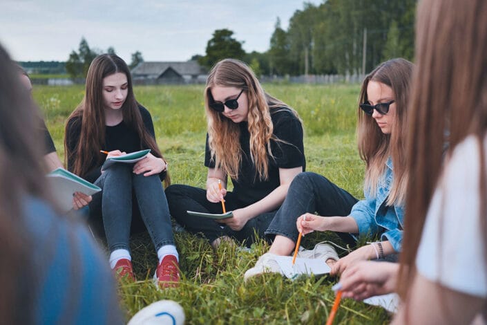 students making notes on a field trip students making notes on a field trip
