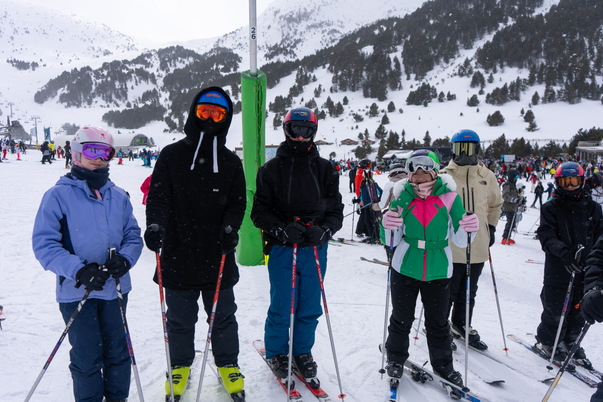 Group of students skiing in snow sure location
